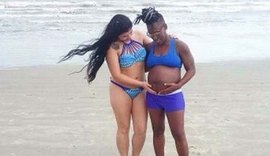 Neném exibe barrigão de seis meses ao lado da esposa