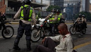 Saques e protestos no centro de Caracas aumentam o clima de convulsão social