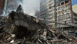 Bombeiros iniciam buscas com máquinas pesadas em edifício que desabou